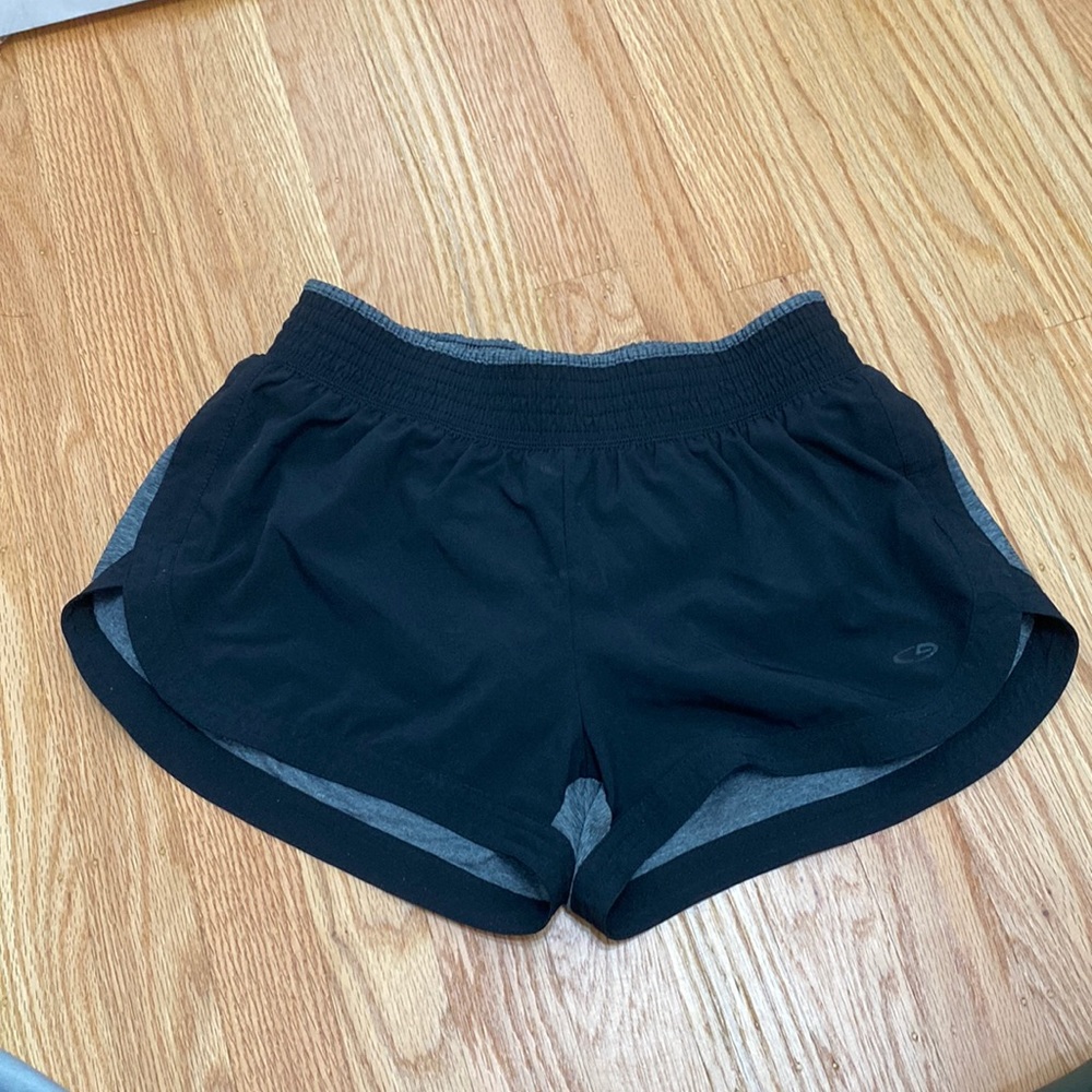 Champion shorts. Black and grey (the back is grey). Built in shorts underneath.